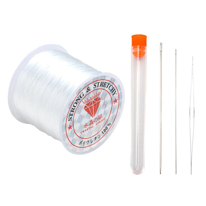 Spool of strong and stretchy thread with a clear container and needles on a white background