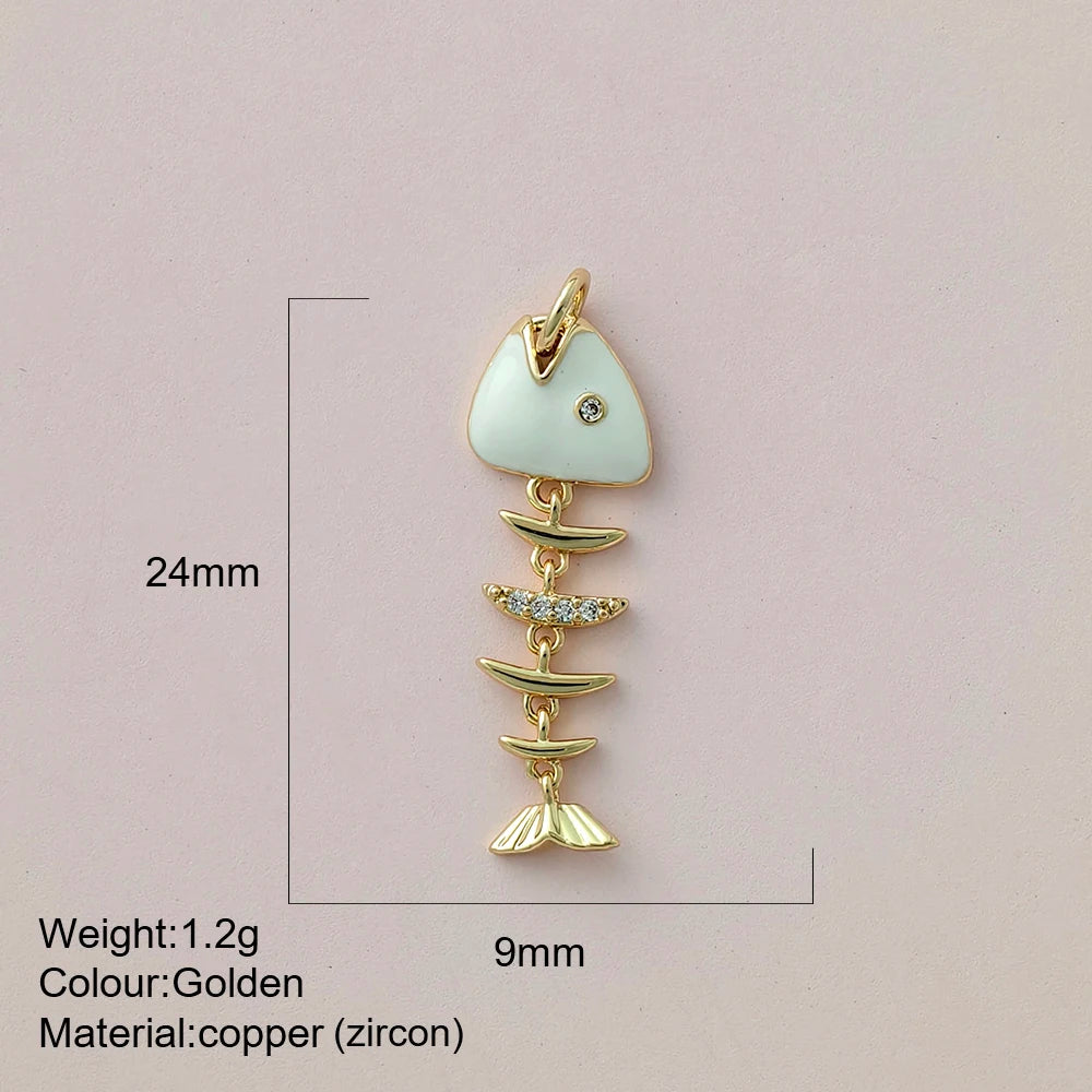 Gold fish-shaped pendant with measurements and material details on a pink background