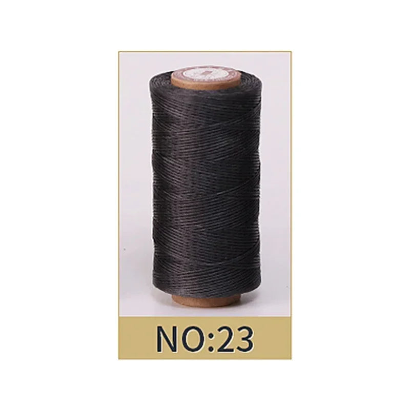 Spool of black thread on a white background with 'NO:23' label