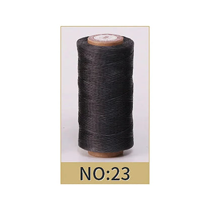 Spool of black thread on a white background with 'NO:23' label