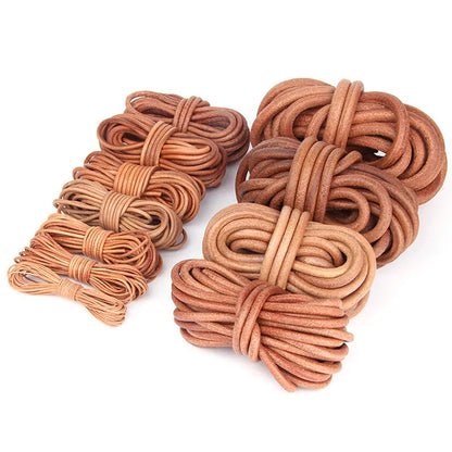 A set of coiled leather cords or loops in various warm tan, brown, and reddish-brown shades, arranged on a plain white background.