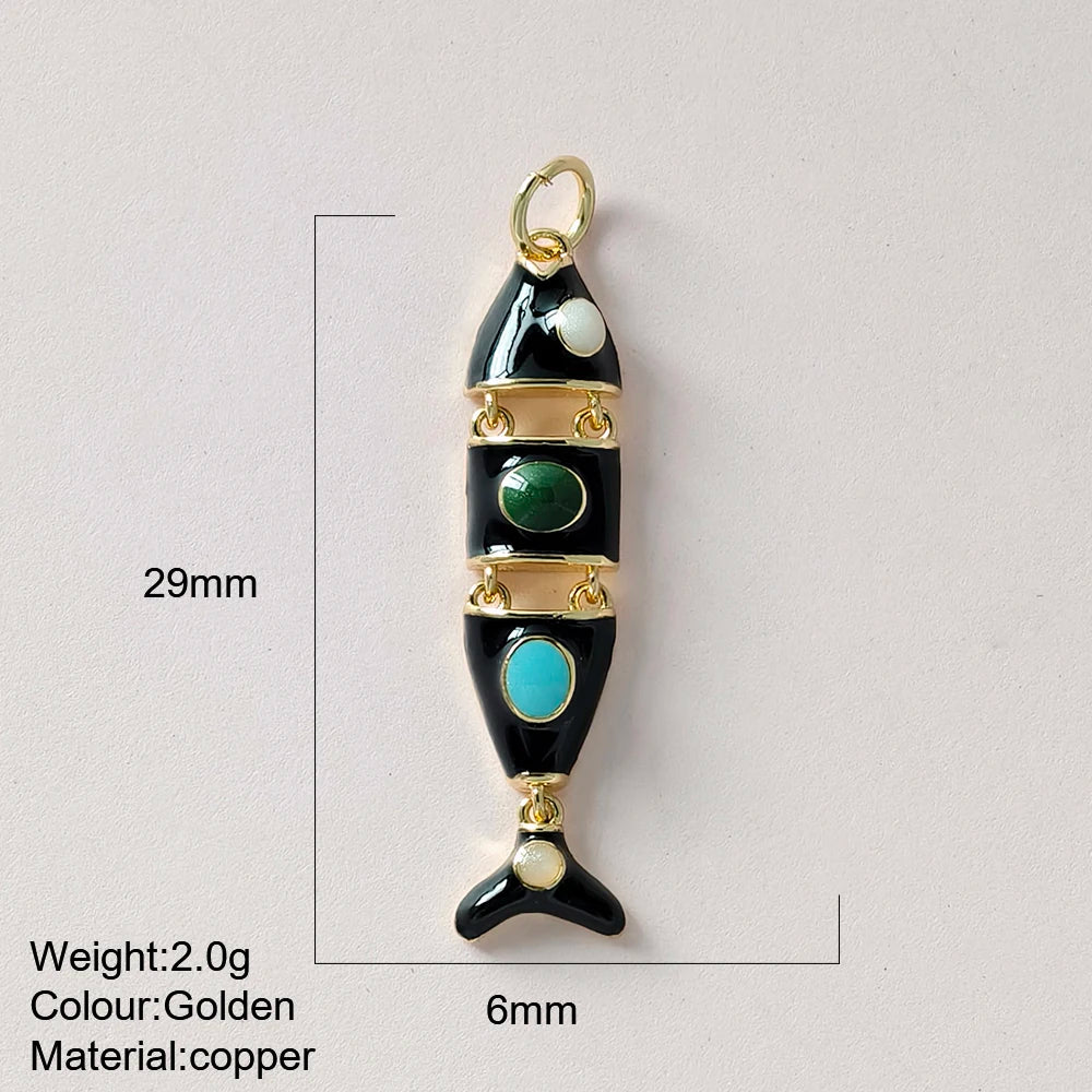 Jewelry pendant with green and blue stones on a light gray background