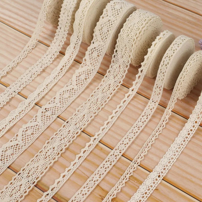 Beige lace ribbons on a wooden surface