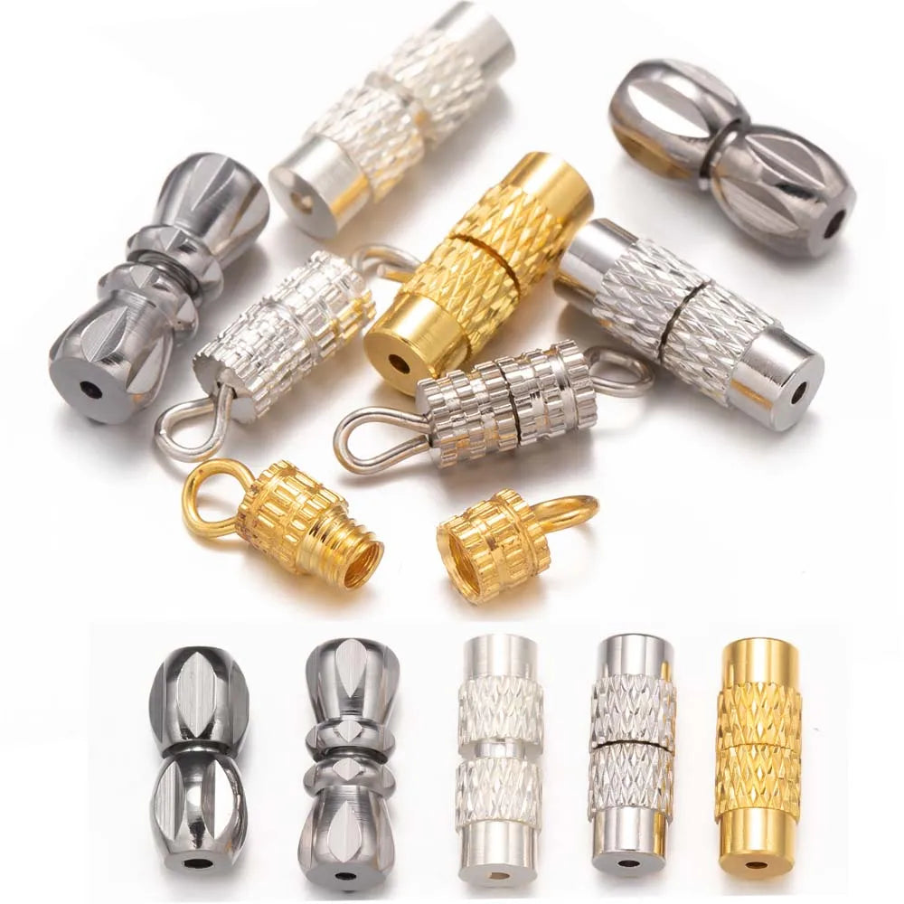 Collection of metallic connectors and clasps in gold, silver, and bronze on a white background