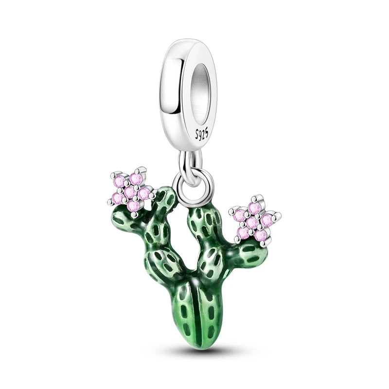 Silver charm with green cactus and pink flowers on a white background