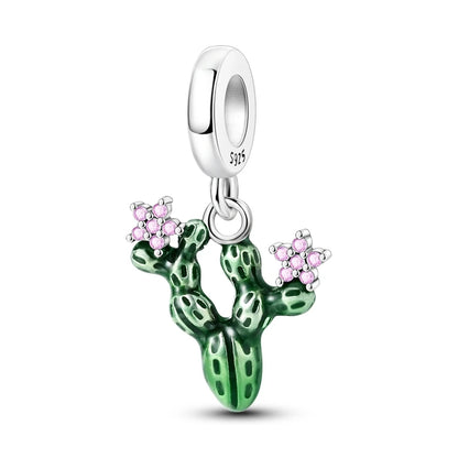 Silver charm with green cactus and pink flowers on a white background