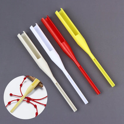 Four plastic fishing line guides in beige, white, red, and yellow, arranged diagonally on a dark gray background, with a circular inset showing one guide attached with red fishing line.
