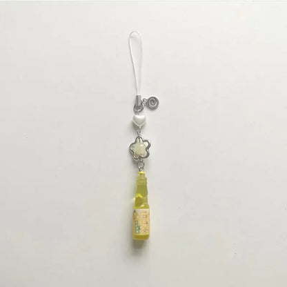 Phone charm with a small bottle design on a white background