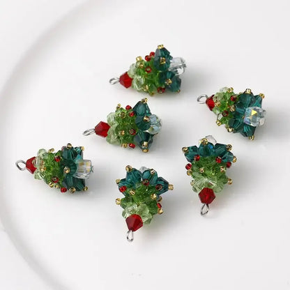 Set of green and red beaded Christmas tree pendants on a white background
