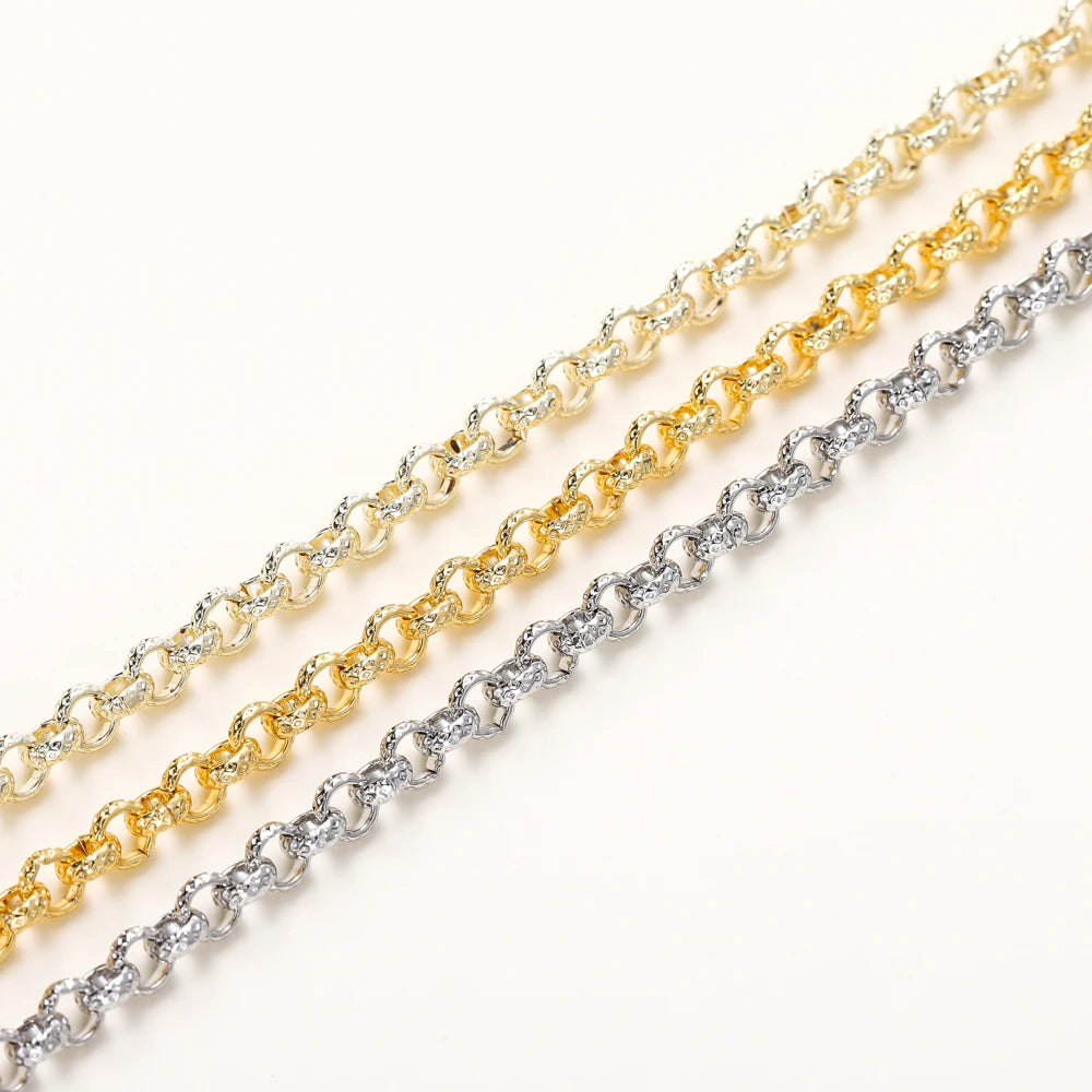 Three rope-style chain necklaces in yellow gold, white gold, and silver, arranged diagonally on a clean white background.