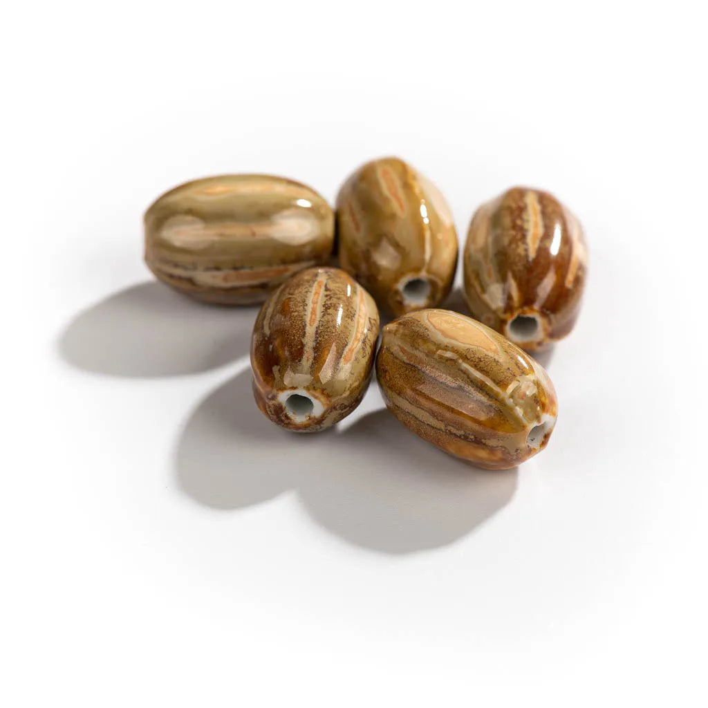Five polished olive stone beads with natural brown and tan striations, arranged on a clean white background with soft shadows.