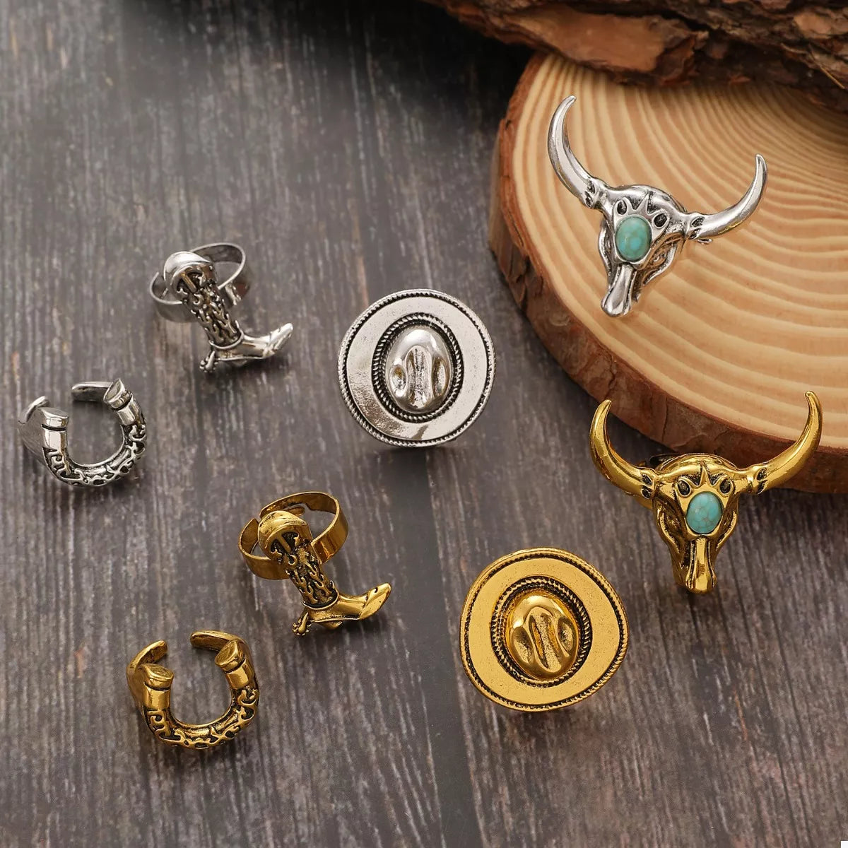 Collection of western jewelry pieces on a wooden surface